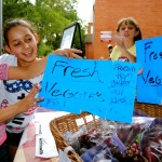 Boys and Girls Club members selling produce at the Youth Farmers Market.