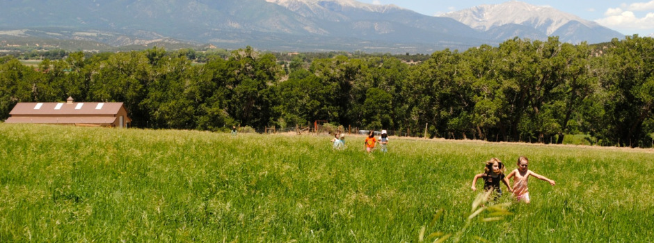 Farmhands in the field at the Hutchinson Ranch.